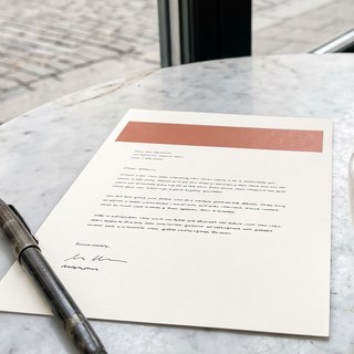 The printed phrase card on a marble table